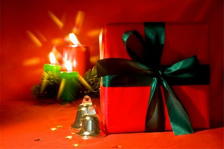 simsearch:400-04272073,k - Burning xmas candle, little gift box and golden hand bells. Christmas decorations of the cross filter effect Foto de stock - Super Valor sin royalties y Suscripción, Código: 400-05180089