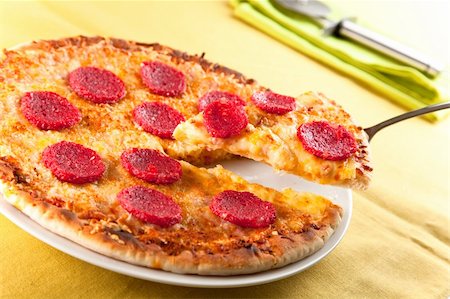 parmesan cheese pieces isolated - delicious melted cheese and pepperoni pizza basil Stock Photo - Budget Royalty-Free & Subscription, Code: 400-05180181