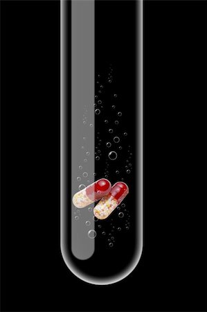 Illustration of a glass test tube with tablets inside it Stock Photo - Budget Royalty-Free & Subscription, Code: 400-05180204