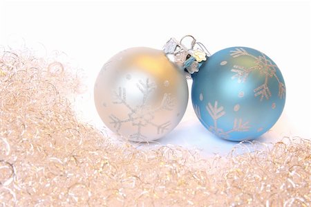 Two Christmas balls and golden tinsel. Isolated on white Stock Photo - Budget Royalty-Free & Subscription, Code: 400-05180854