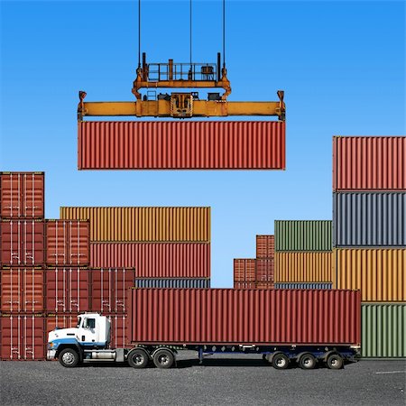 shipping containers on trucks - Stack of freight containers at the docks with Truck Stock Photo - Budget Royalty-Free & Subscription, Code: 400-05180920
