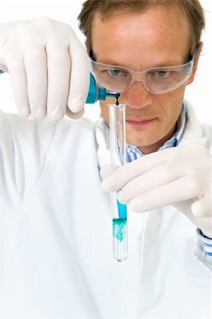 Chemist, diluting a blue substance in a test tube Stock Photo - Budget Royalty-Free & Subscription, Code: 400-05181074