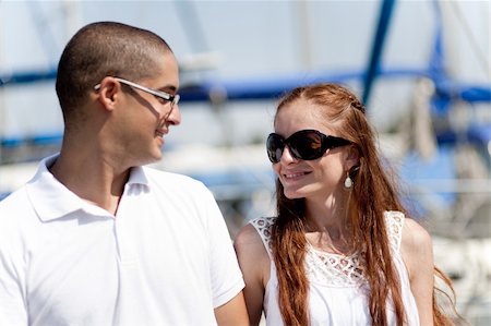 Happy young couple looking each other at the harbour Stock Photo - Budget Royalty-Free & Subscription, Code: 400-05181769