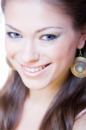 closeup portrait of attractive smiling young woman with ear-rings Stock Photo - Budget Royalty-Free & Subscription, Code: 400-05182000
