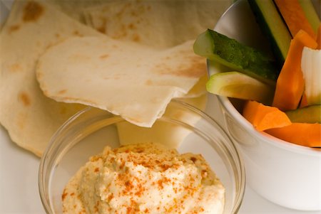 middle eastern hummus dip on a glass bowl with homemade pita brad and raw vegetable Stock Photo - Budget Royalty-Free & Subscription, Code: 400-05183127