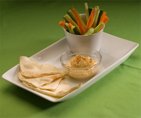 middle eastern hummus dip on a glass bowl with homemade pita brad and raw vegetable Stock Photo - Budget Royalty-Free & Subscription, Code: 400-05183130