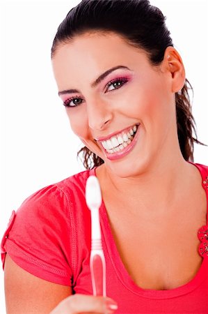 beautiful young woman holding tooth brush and smiling in isolated white backround Stock Photo - Budget Royalty-Free & Subscription, Code: 400-05183942