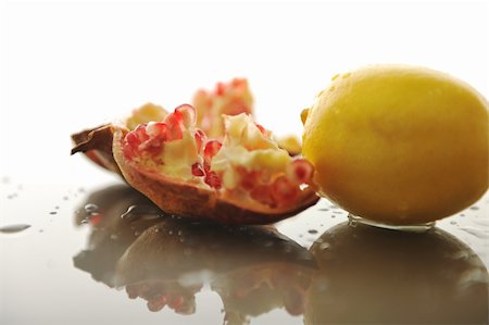 simsearch:400-09220883,k - fresh and healthy fruit food lemon and Pomegranate isolated on white Stock Photo - Budget Royalty-Free & Subscription, Code: 400-05183984