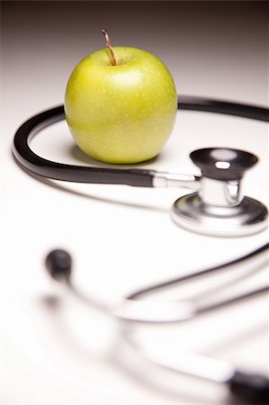 simsearch:400-07312536,k - Stethoscope and Green Apple on Gradated Background with Selective Focus. Stock Photo - Budget Royalty-Free & Subscription, Code: 400-05194060