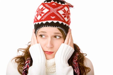 simsearch:6110-09101637,k - Young woman is freezing and wearing a cap and a scarf with hands in her face. Isolated on white. Stockbilder - Microstock & Abonnement, Bildnummer: 400-05194397