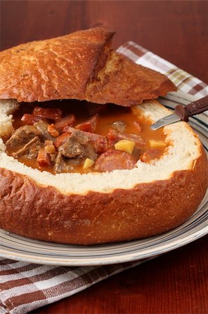 stew sausage - Goulash soup with beef, potato and meat sausage, served in a bread bowl Stock Photo - Budget Royalty-Free & Subscription, Code: 400-05195372
