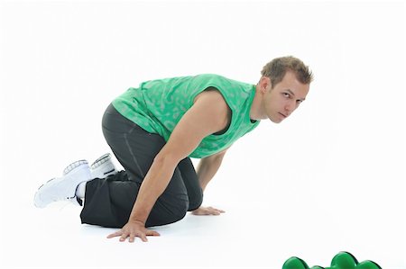 simsearch:400-06083451,k - strong young man exercise fitness isolated on white Photographie de stock - Aubaine LD & Abonnement, Code: 400-05195424