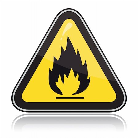 Yellow triangular warning sign. Attention flammable Fotografie stock - Microstock e Abbonamento, Codice: 400-05195666