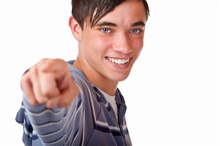 simsearch:400-05912376,k - Close-up of teenager pointing with finger on camera. Isolated on white. Foto de stock - Super Valor sin royalties y Suscripción, Código: 400-05195679