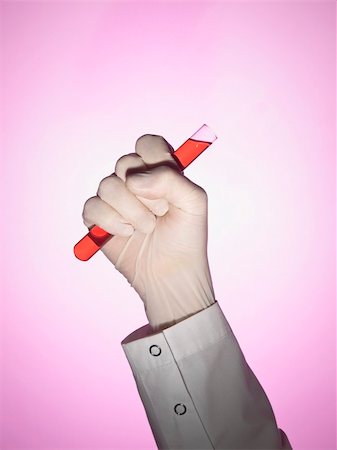 pink science - A scientist holds a test tube on his fist. Stock Photo - Budget Royalty-Free & Subscription, Code: 400-05196039