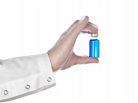 simsearch:400-07976801,k - A doctor holds a vial full of blue liquid with his latex gloves on. Isolated on white. Foto de stock - Super Valor sin royalties y Suscripción, Código: 400-05196073