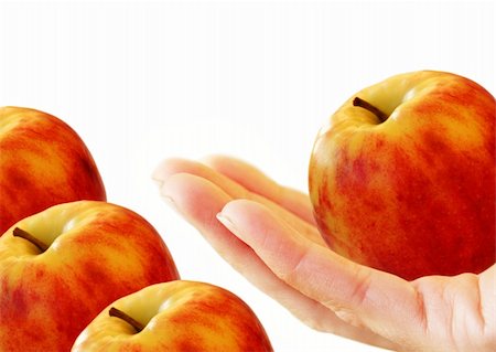 simsearch:400-05196174,k - Red-yellow apple in hand on a white background Photographie de stock - Aubaine LD & Abonnement, Code: 400-05196174
