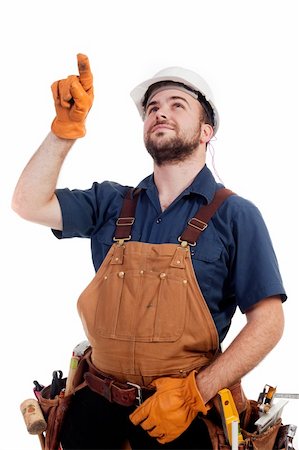a construction worker pointing up at something isolated Stock Photo - Budget Royalty-Free & Subscription, Code: 400-05196614