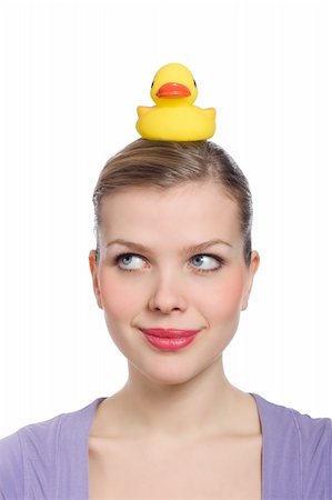 young woman with a yellow rubber duck on her head Stock Photo - Budget Royalty-Free & Subscription, Code: 400-05196850