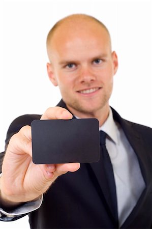 simsearch:400-05718318,k - Business man handing a blank business card over white background Foto de stock - Super Valor sin royalties y Suscripción, Código: 400-05197120