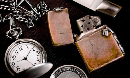 simsearch:600-01551669,k - still life with pocket watch, knife and lighter Stock Photo - Budget Royalty-Free & Subscription, Code: 400-05197843