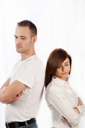 divorced family - Young couple fights. Both people stand back to back and look sad Stock Photo - Budget Royalty-Free & Subscription, Code: 400-05199049