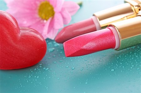 Two new lipsticks and pink flower on blue background Stock Photo - Budget Royalty-Free & Subscription, Code: 400-05199786