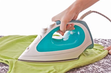 simsearch:400-03988966,k - A woman ironing a t-shirt Stock Photo - Budget Royalty-Free & Subscription, Code: 400-05190145