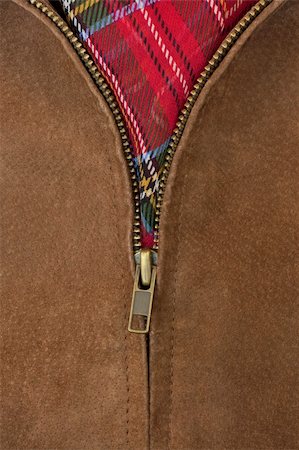 close-up of unzipped brass zipper of chamois leather jacket showing a red scarf Photographie de stock - Aubaine LD & Abonnement, Code: 400-05190473