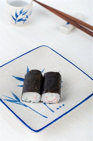 simsearch:689-03123940,k - sushi on a plate with chopstick and tea cup Photographie de stock - Aubaine LD & Abonnement, Code: 400-05191041