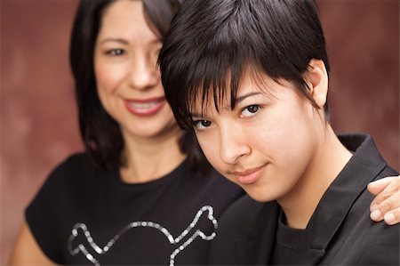 Attractive Multiethnic Mother and Daughter Studio Portrait. Stock Photo - Budget Royalty-Free & Subscription, Code: 400-05191502