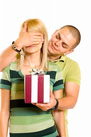 man surprising a woman with present over white background Stock Photo - Budget Royalty-Free & Subscription, Code: 400-05191735