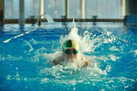 simsearch:400-04731600,k - health and fitness lifestyle concept with young athlete swimmer recreating  on olimpic pool Stock Photo - Budget Royalty-Free & Subscription, Code: 400-05192207