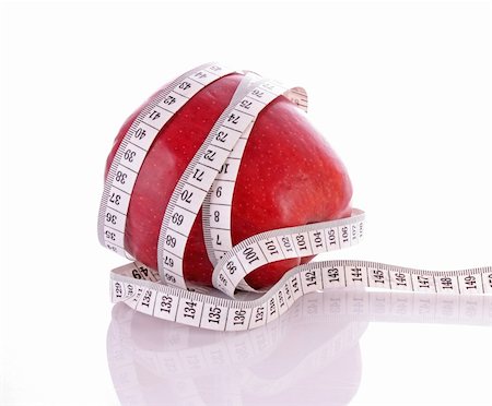 simsearch:400-07613657,k - White tape measure around a red apple representing dieting Stock Photo - Budget Royalty-Free & Subscription, Code: 400-05192398