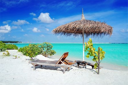 simsearch:400-05705880,k - Beautiful Maldivian beach with parasol and two deck chairs in the front Stockbilder - Microstock & Abonnement, Bildnummer: 400-05192408
