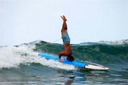 surfing extreme sport - Young men - the surfer in ocean. Bali. Indonesia Stock Photo - Budget Royalty-Free & Subscription, Code: 400-05193158