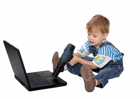 photography setup - Boy Repairing the notebook with screwdriver Stock Photo - Budget Royalty-Free & Subscription, Code: 400-05193280