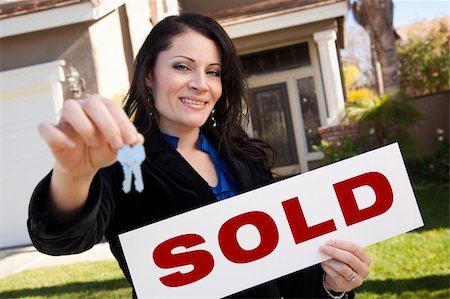 simsearch:400-04350998,k - Happy Attractive Hispanic Woman Holding Keys and Sold Sign In Front of House. Stock Photo - Budget Royalty-Free & Subscription, Code: 400-05193536