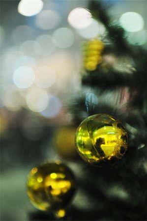xmas tree decoration closeup with blured lights in shopping centre in backgroun Stock Photo - Budget Royalty-Free & Subscription, Code: 400-05204380