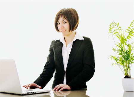 one young business woman isolated on white working on laptop computer Stock Photo - Budget Royalty-Free & Subscription, Code: 400-05204470