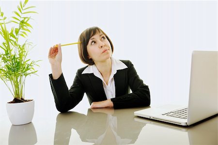 one young business woman isolated on white working on laptop computer Stock Photo - Budget Royalty-Free & Subscription, Code: 400-05204485