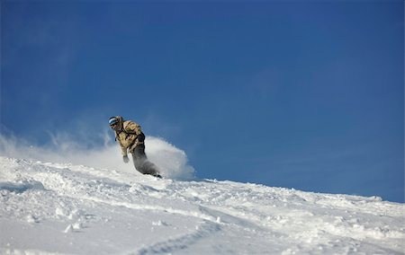 simsearch:400-06133858,k - freestyle snowboarder jump and ride free style  at sunny winter day on mountain Stock Photo - Budget Royalty-Free & Subscription, Code: 400-05204514
