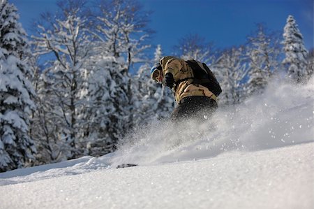 simsearch:400-05204614,k - freestyle snowboarder jump and ride free style  at sunny winter day on mountain Stock Photo - Budget Royalty-Free & Subscription, Code: 400-05204537