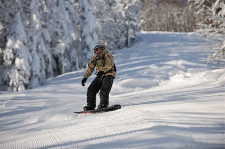 simsearch:400-05204614,k - freestyle snowboarder jump and ride free style  at sunny winter day on mountain Stock Photo - Budget Royalty-Free & Subscription, Code: 400-05204530