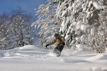 simsearch:400-05204614,k - freestyle snowboarder jump and ride free style  at sunny winter day on mountain Stock Photo - Budget Royalty-Free & Subscription, Code: 400-05204531