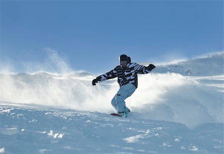 simsearch:400-05204614,k - freestyle snowboarder jump and ride free style  at sunny winter day on mountain Stock Photo - Budget Royalty-Free & Subscription, Code: 400-05204542