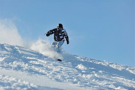 simsearch:400-05204614,k - freestyle snowboarder jump and ride free style  at sunny winter day on mountain Stock Photo - Budget Royalty-Free & Subscription, Code: 400-05204555