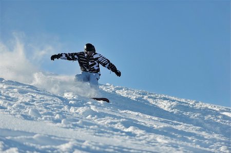 simsearch:400-05204614,k - freestyle snowboarder jump and ride free style  at sunny winter day on mountain Stock Photo - Budget Royalty-Free & Subscription, Code: 400-05204556