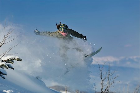 simsearch:400-05204614,k - freestyle snowboarder jump and ride free style  at sunny winter day on mountain Stock Photo - Budget Royalty-Free & Subscription, Code: 400-05204559