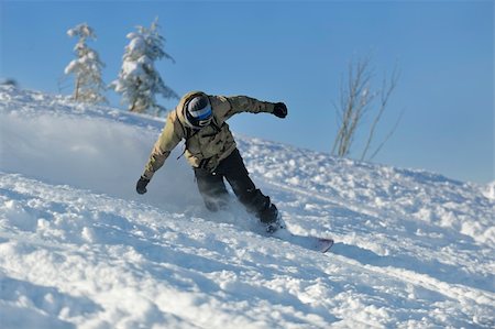simsearch:400-06133858,k - freestyle snowboarder jump and ride free style  at sunny winter day on mountain Stock Photo - Budget Royalty-Free & Subscription, Code: 400-05204553